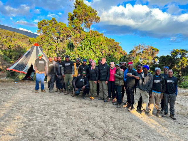 <p><em>Blanchard’s “trekking family,” many whom have summited Kili more than 100 times.  They carried duffle bags, food, water, and set up our tents, all to support Blanchard’s climb. </em></p>