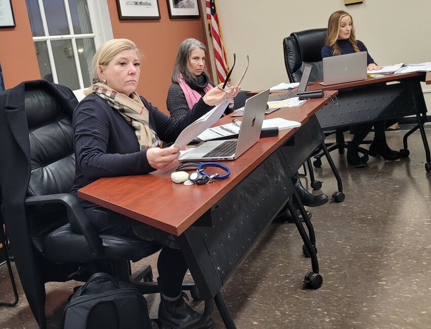 Board members Christine Delisio, Laura Tenney and Mary Foley at Monday’s Planning Board meeting in Manchester.