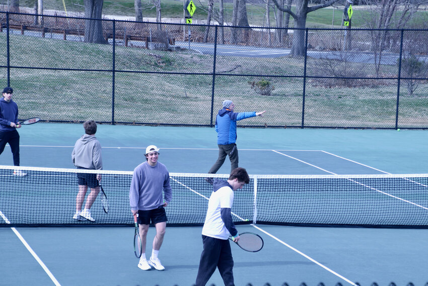 Coach Bilsbury prepares his team for a successful season on a cold afternoon at the Memorial School courts.