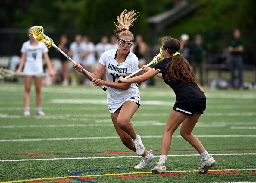 Mechi O’Neil racing to the goal during a Sweet 16 match against Nipmuc.  The Hornets win by 16-4 sent them to the Elite 8 against the Cohasset Skippers. 
