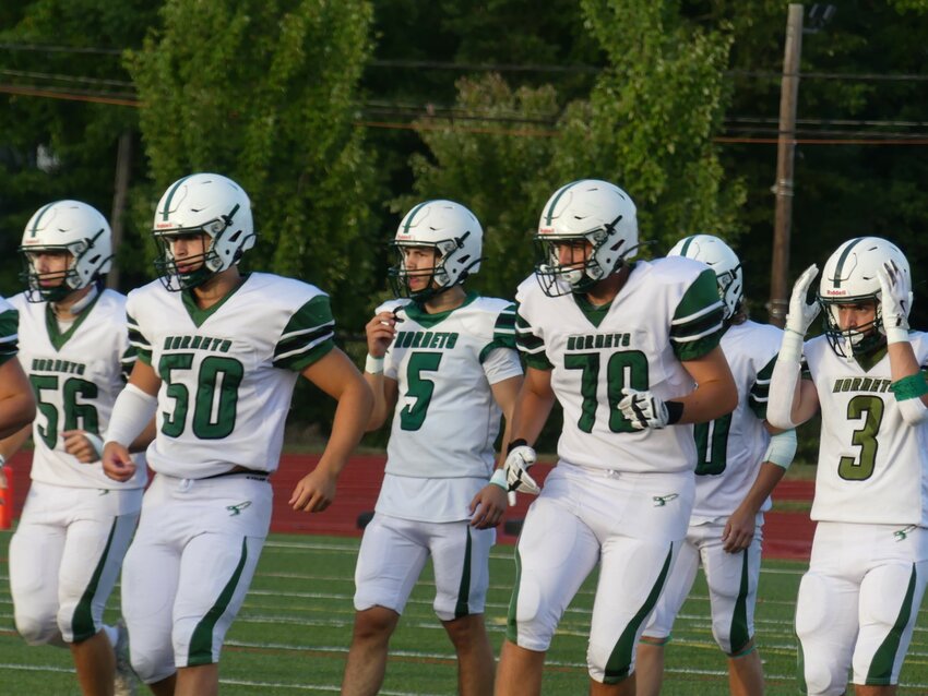 Members of the ME Hornets football squad line up for a game.  Pictured are #56 Joe Glass (Jr. OL/LB), #50 Walker Valeo (Jr. OL/DL), #5 Zach Hurd (Jr. QB/S), #70 Chris Glass (Jr. OL/DL) and #3 is Gabe Magee (Sr. RB/LB).