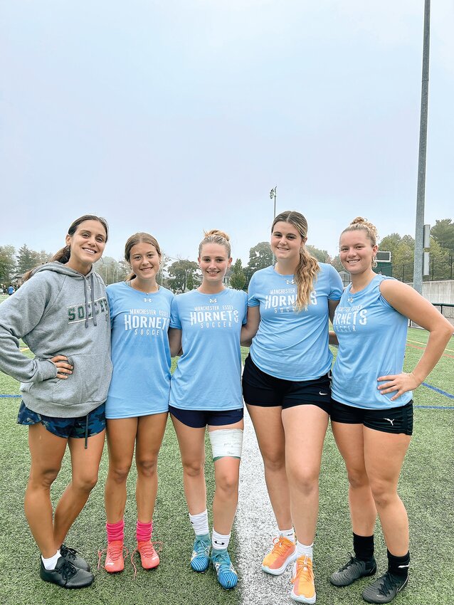 Lady Hornets soccer Captains from left to right: Coach Scout Grifoni, Charlotte Crocker, Ella Arntsen, Madi Cook and Libby Lawler.