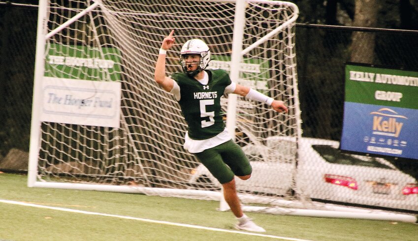 Hornet quarterback Zach Hurd celebrates ME’s first touchdown against Rockland at home on Friday night.  Under the lights and with a packed stadium the Hornets delivered a 38-18 win.  They are 2-0 this early in the season.