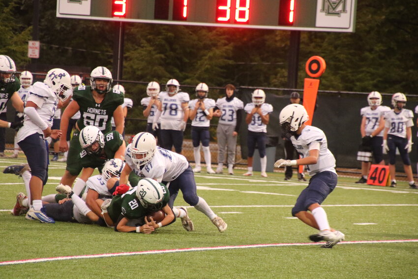 ME Hornet Conrad Garfield punches through the Rockland defense during a Friday night 38-18 win over the Bulldogs.