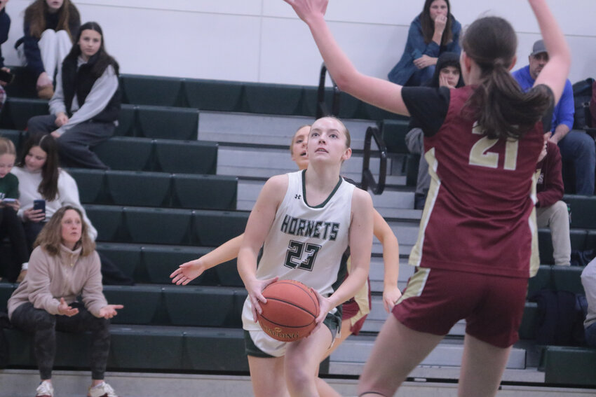 Anna Gardner has played consistent ball over the Hornet’s season. Here shown going for two in a recent match against Newburyport.  ME currently at 6-12..