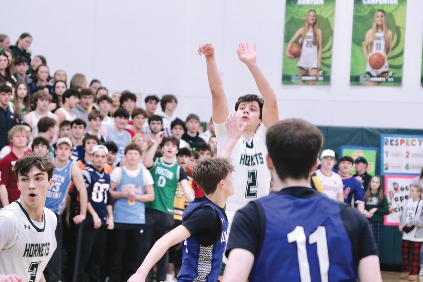 Hornet #2, Graham Lewis, stops and pops against Waconah in MIAA’s Tournament Round of 32.