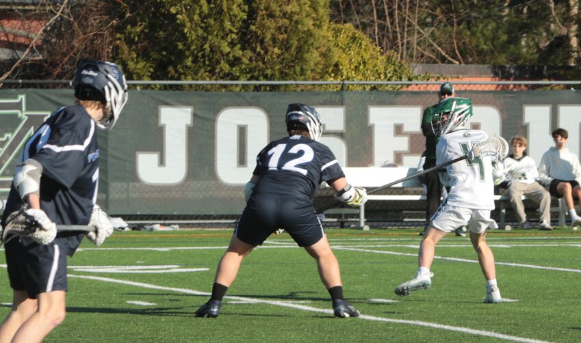 Jack McCavanagh winds up to fire a shot between the pipes against rivals Swampscott.