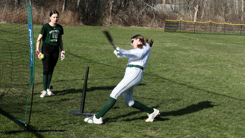 Aliyah Doyon takes some batting practice before a cancelled game due to a wet field.  The Lady Hornets are 3-0 at this point in the season.