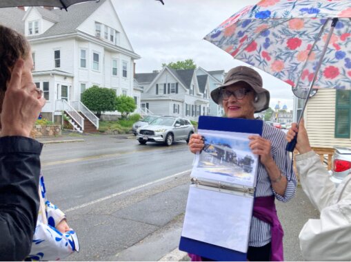 Cape Ann Museum Docent Trina Smith takes visitors along Prospect Street in Gloucester to see how painter Edward Hopper depicted a streetscape in the mid 1920’s that is still present a century on. Two walking tours feature the work and painting lifestyle of Edward Hopper and his wife, Jo, as they sought painting subjects around the city.