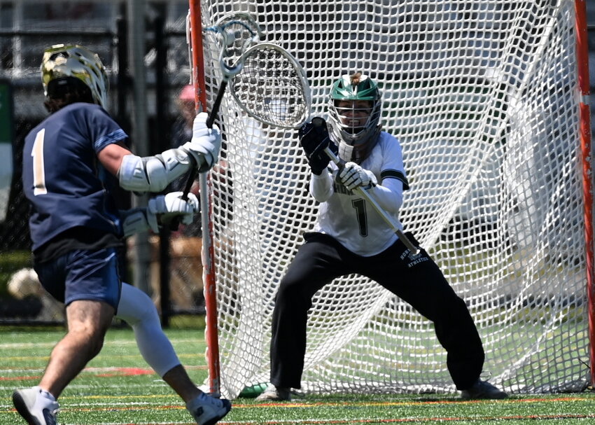 ME Hornet Connor Dickson prepares to defend the net against East Bridgewater as the Hornets roll to a 17-4 win.