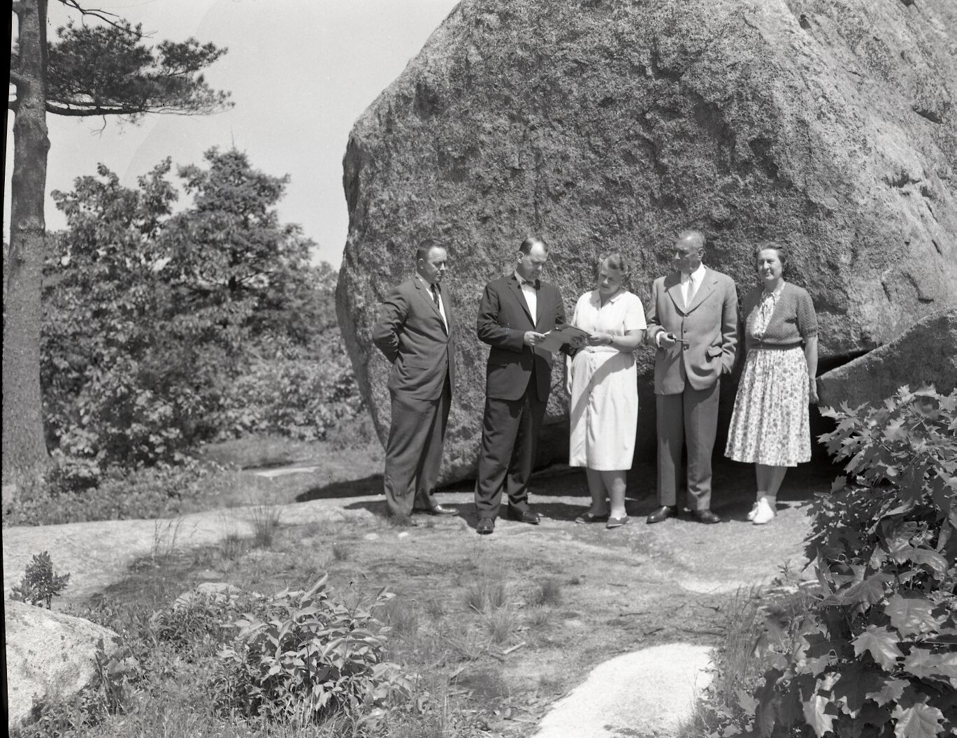 A group of Agassiz’ students named Agassiz Rock property in the 1870s.  In 1957, it was acquired by the Trustees of Reservation. Here, far left, Daniel F. Slade (publisher/editor of the Manchester Cricket) and Francis L. “Quitsie” Burnette (middle) a Manchester environmentalist. (Photo: The Cricket)