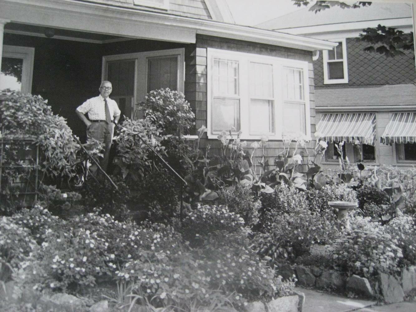 Frank Albano, in front of his garden.