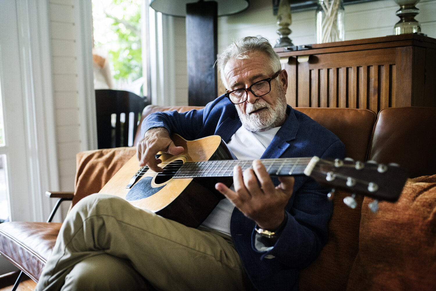 An,Elderly,Man,Is,Playing,Guitar