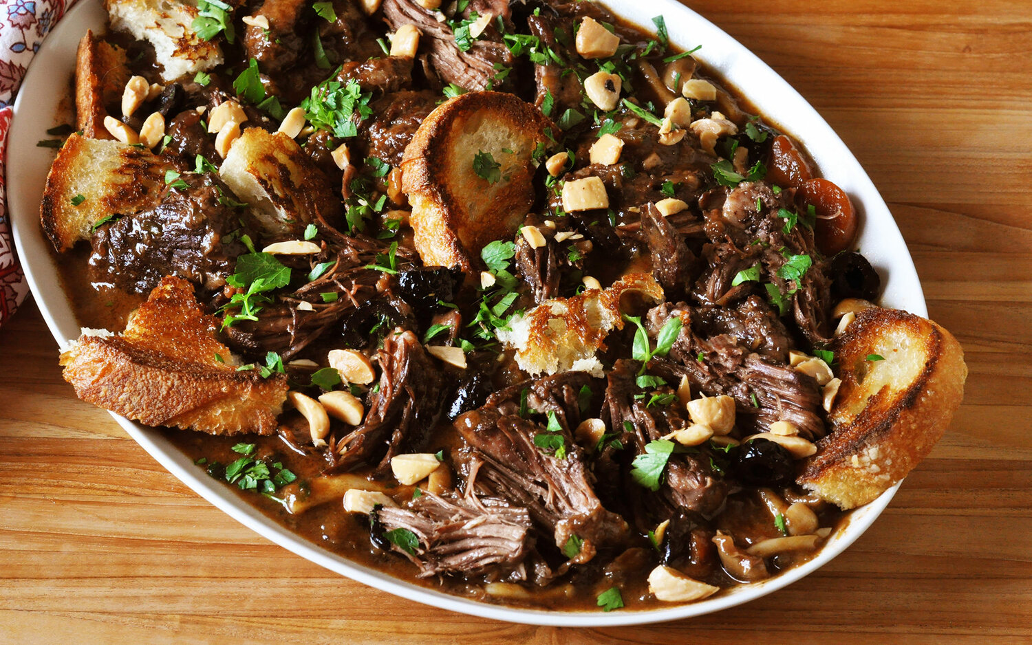 Catalan Short Ribs with Oyster Mushrooms, a dish that highlights the flavors of Oyster Mushrooms in a great holiday meal.