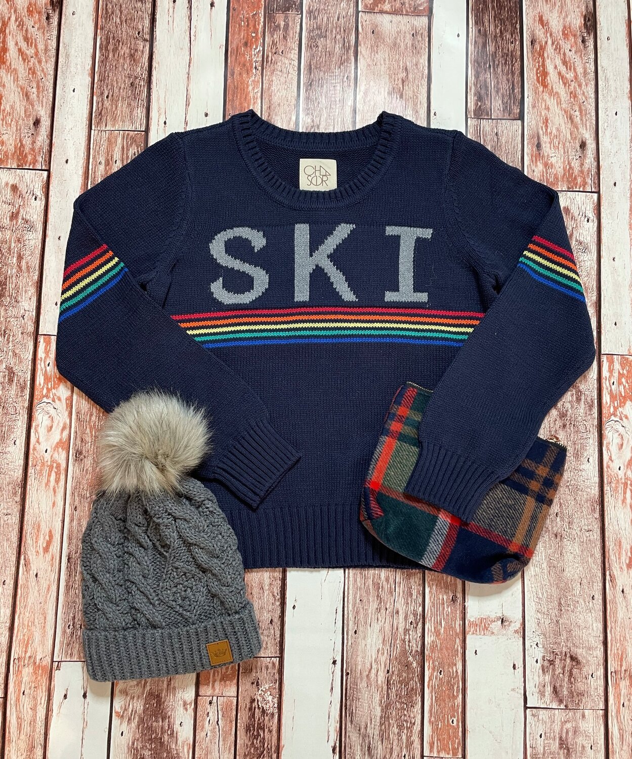 Cozy “I’m Skiing This Weekend” Set Up | From the local shop that makes dashing out for the weekend easy, Style Snoop offers this cute set up for ski lovers.  Hat, 24$ , Sweater, 78$ , Pouch Purse, $18.Style Snoop | ManchesterMonday - Saturday | 10 a.m. to 6 p.m.Sunday | Noon to 5 p.m.(978) 704-9881