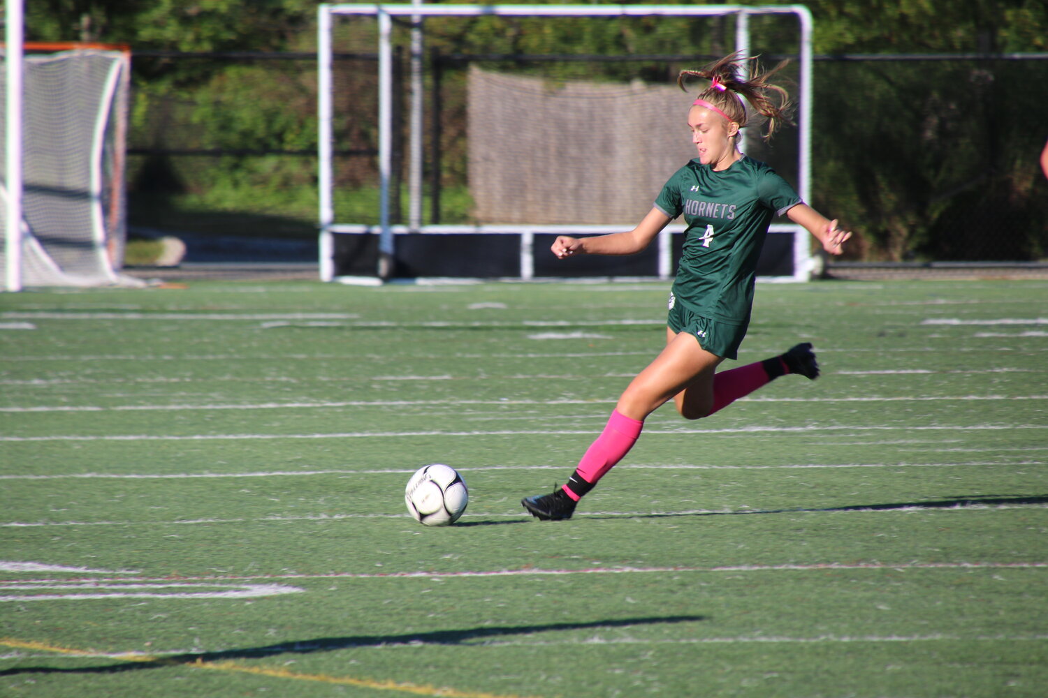ME sophomore Mercedes O'Neil fires the ball down during the Hornets’ match against Swampscott at home