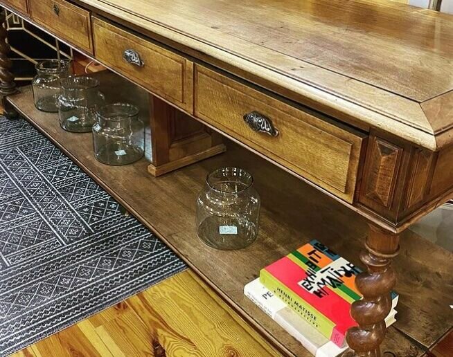 This antique walnut table from Muzio Designs in Essex was the centerpiece to a kitchen design for a client at In Home Design Center, also in Essex.  (Courtesy photo)