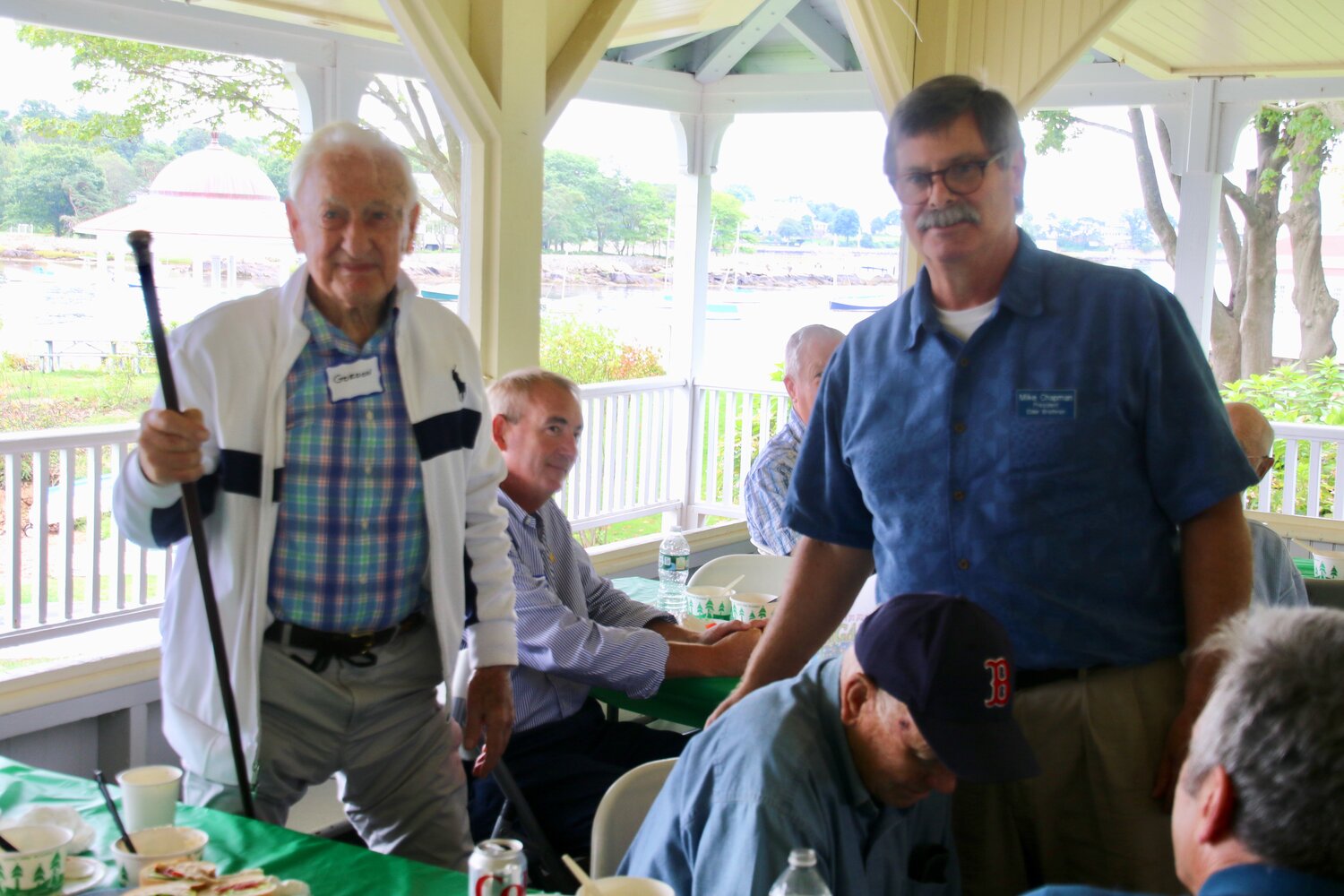 Gordon MacDoughal, Manchester's eldest male resident, receives the Elder Brethren Cane from Mike Chapman at the 2021 annual "Old Man's Picnic" at Tuck's Point.