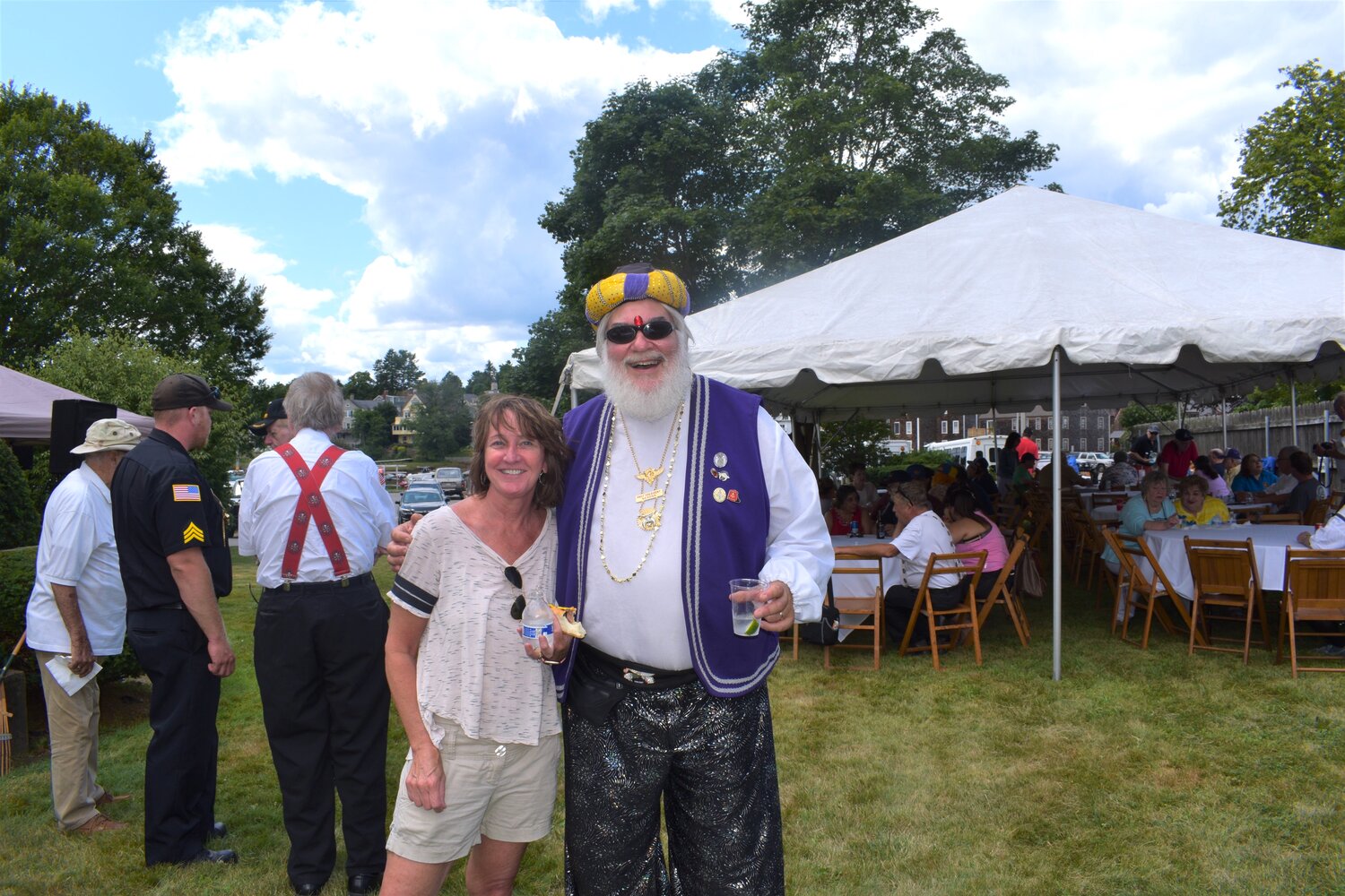 Carol Brown with a member of the Shriners parade crew at the post Parade cookout at the Manchester Masonic Hall in 2019, after the Town of Essex Bicentennial Parade.