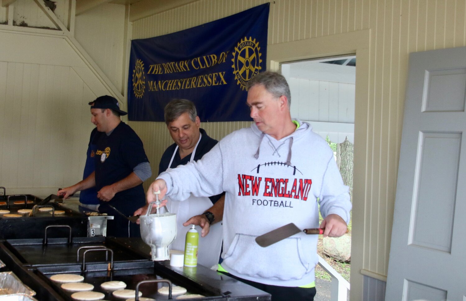 Senator Bruce Tarr and Representative Brad Hill ably manned the pancake station on the Rotary's Red White &amp; Blue breakfast. Turnout was great - even with an iffy weather report. 