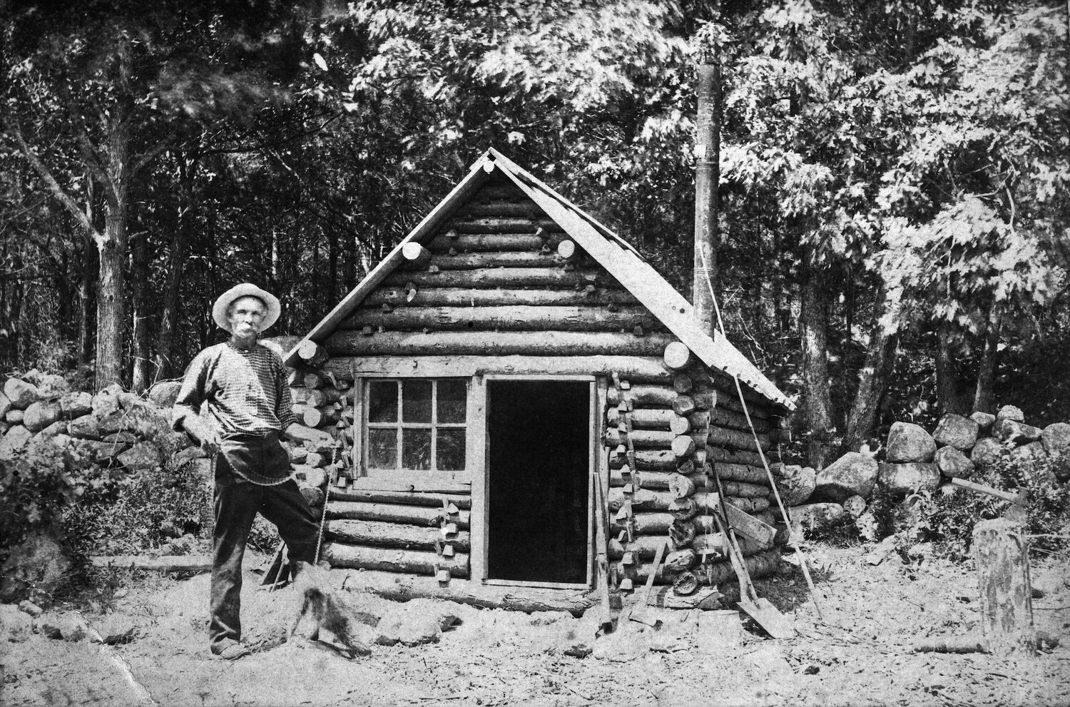 Mason Augustus Walton at age 49, in front of his home in the back woods of Ravenswood. 