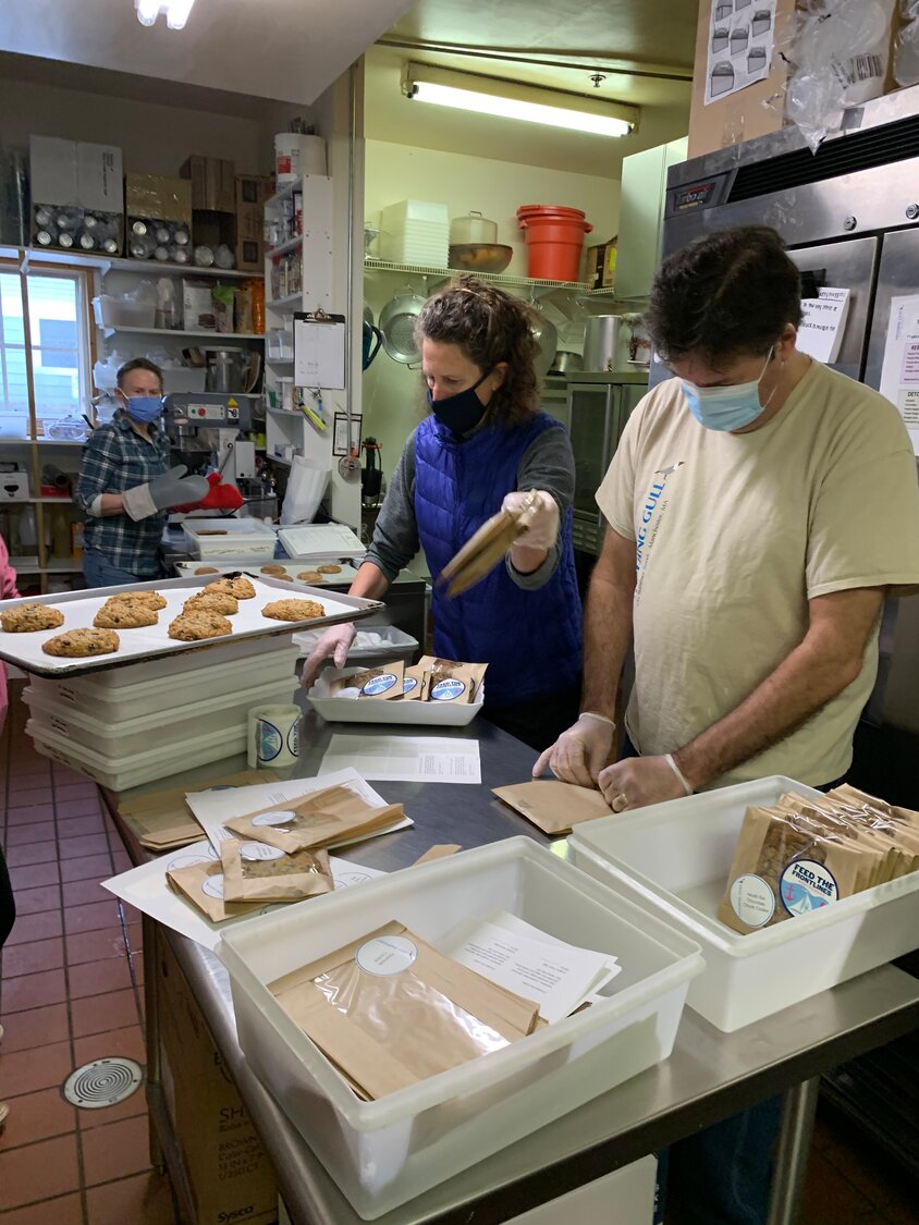 Deede and Bruce Warren from Laughing Gull hard at work, preparing food for frontline COVID vaccine workers. 