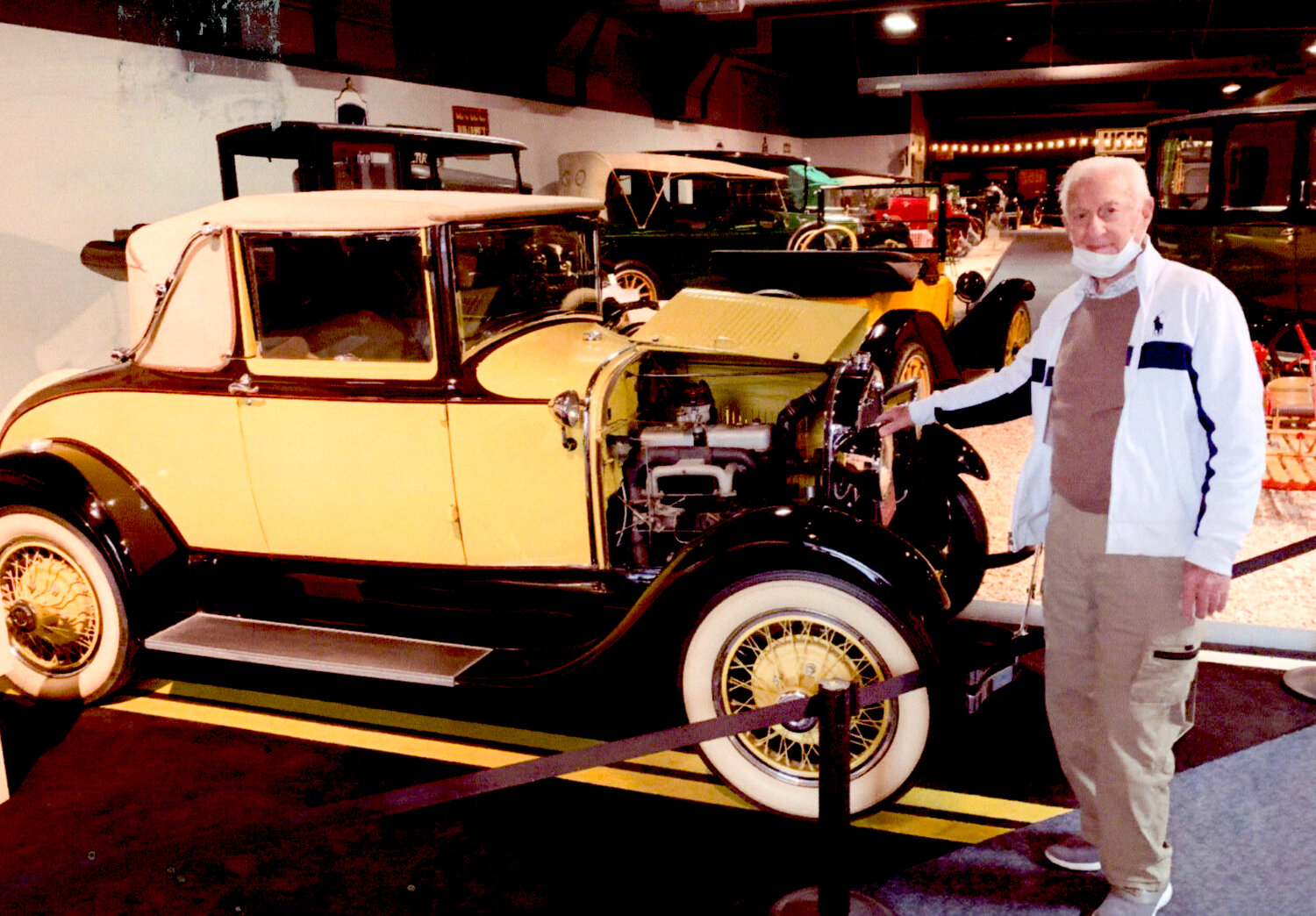Gordon MacDougall, 97, posing in front of a 1930 Model A Ford, which was the model his father purchased for the family in Prince Edward Island in Canada.