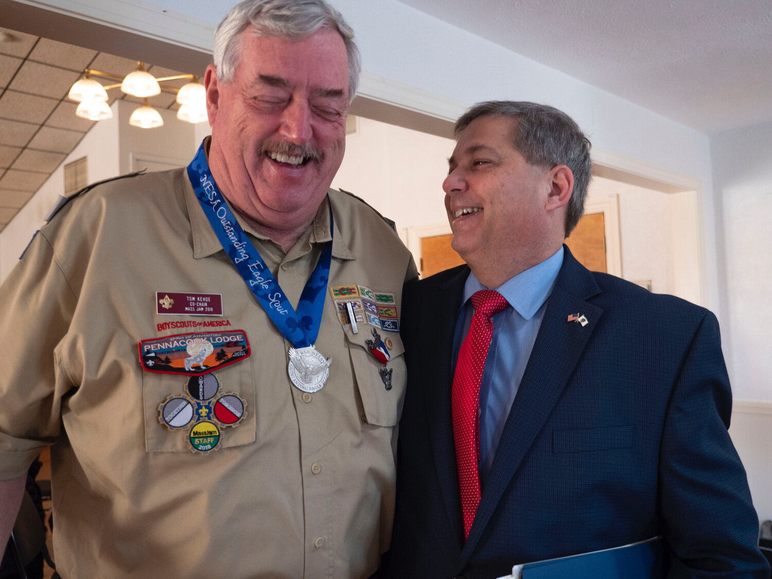 Tom Kehoe, former Manchester Selectman and the oldest living Eagle Scout from Troop3 (1969) jokes with Massachusetts Senate Majority Leader Bruce Tarr.