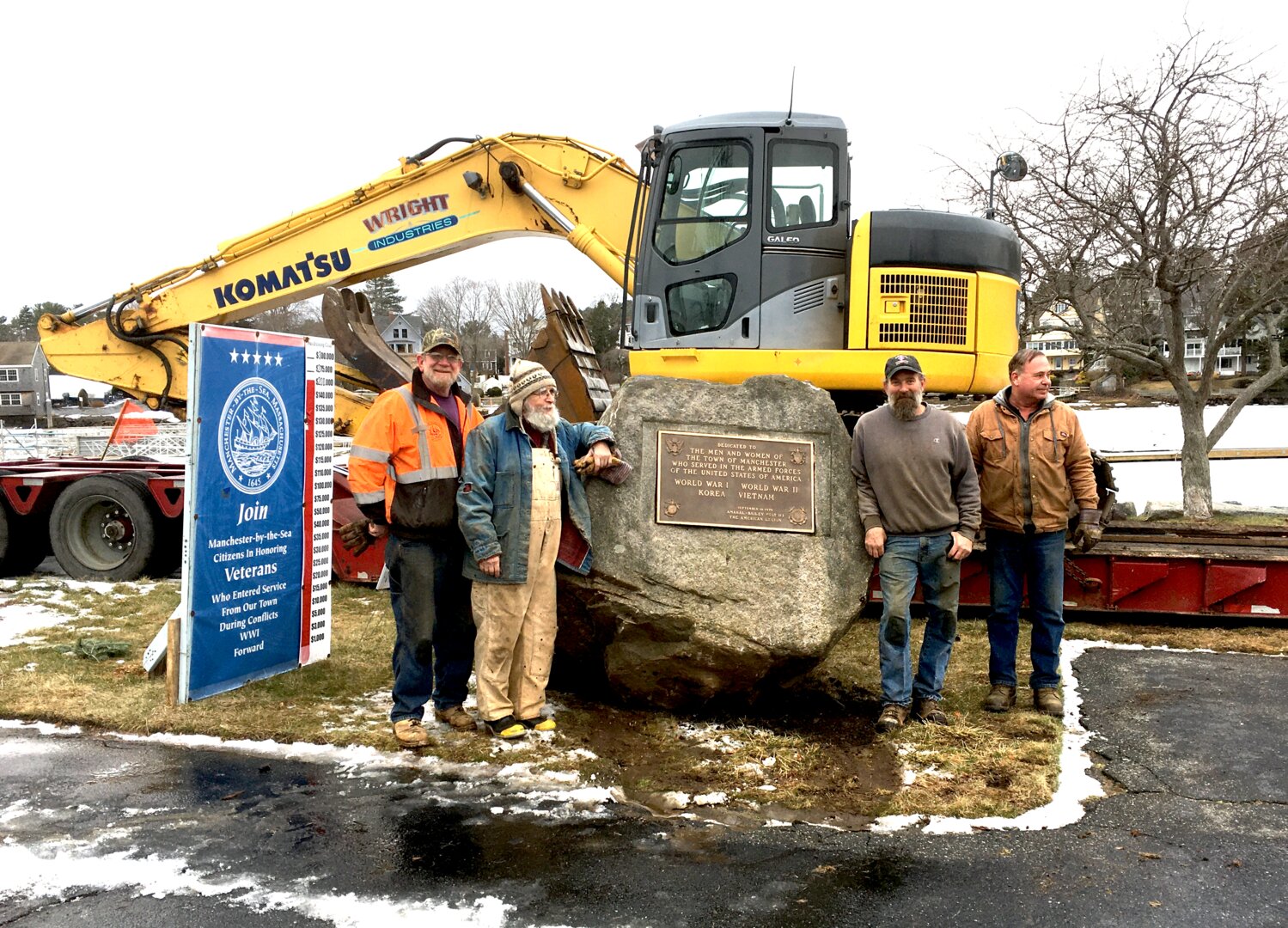 FEBRUARY | The moving of the old Veterans Memorial in Manchester quietly took place several weeks ago, thanks for a series of volunteers.  First up, the “before” shot, with the memorial boulder being “gurney’ed” in preparation for its journey to its new home in front of the Amaral Bailey American Legion Hall.   In the "after" second photo, from left to right, is Dave Doucette, John Saco, Bob Spintig and Paul Wright—all volunteers.  Spintig graciously provided and operated all the heavy equipment required from his company, Wright Industries.