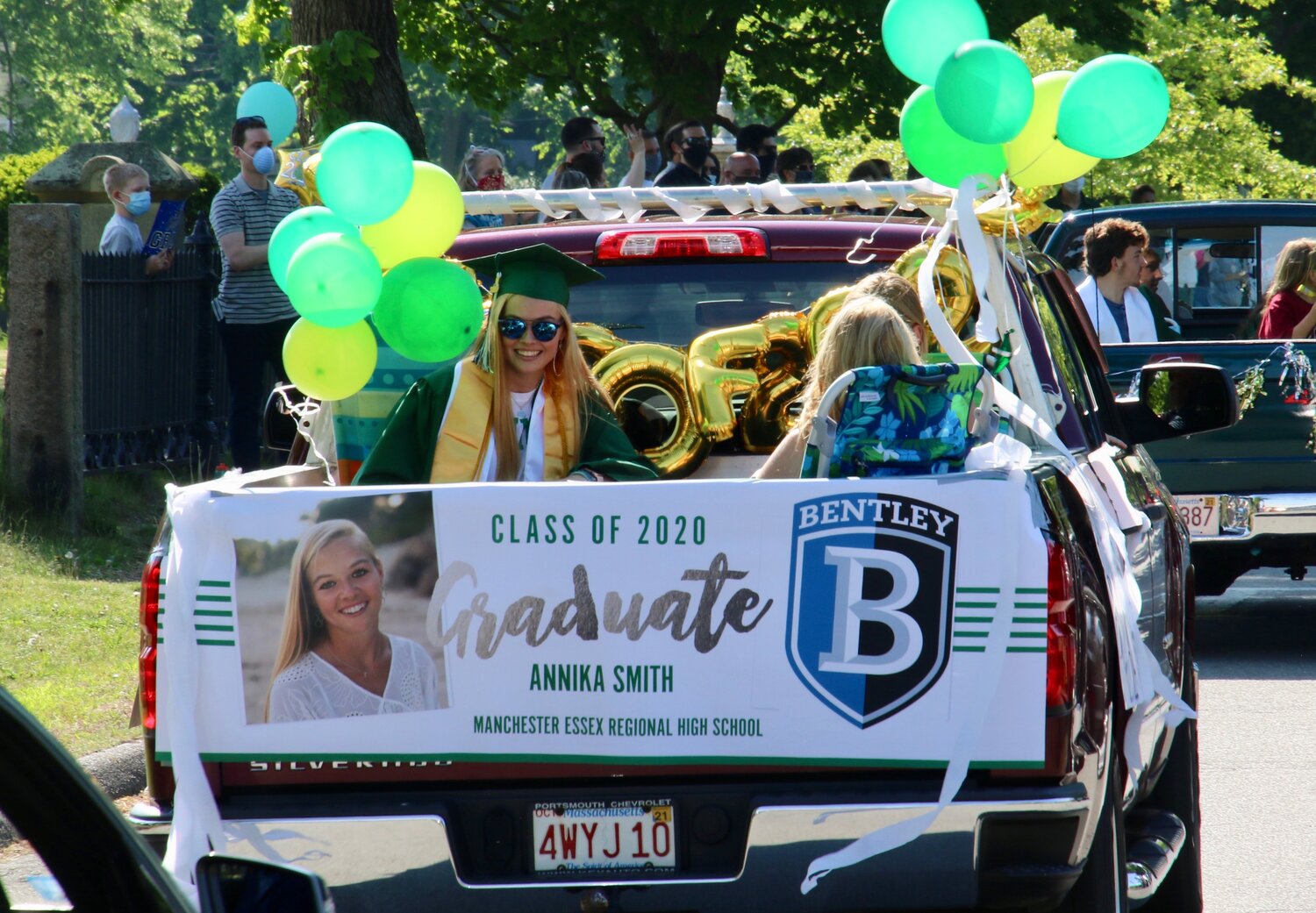 JUNE | A Classy 2020 ParadeOn June 5, Manchester Essex High School seniors and their families pulled up to the high school in cars decorated with green and white streamers, washable paint, and balloons.  And, writes M-E Junior Olivia Turner on Page 5, seniors poked out of sunroofs and hung out windows, the green sleeves of their gowns flowing in the breeze. That day had been the day the class was supposed to “walk,” and conduct its 2020 Graduation Ceremony.  Like all other schools across the country, a pandemic has put these plans on hold until—at least for now—July.  So instead of walking, they all drove in decorated cars in an automobile parade that took them from Manchester to Martin Street in Essex.  The community waited for them on sidewalks, lining the streets. 