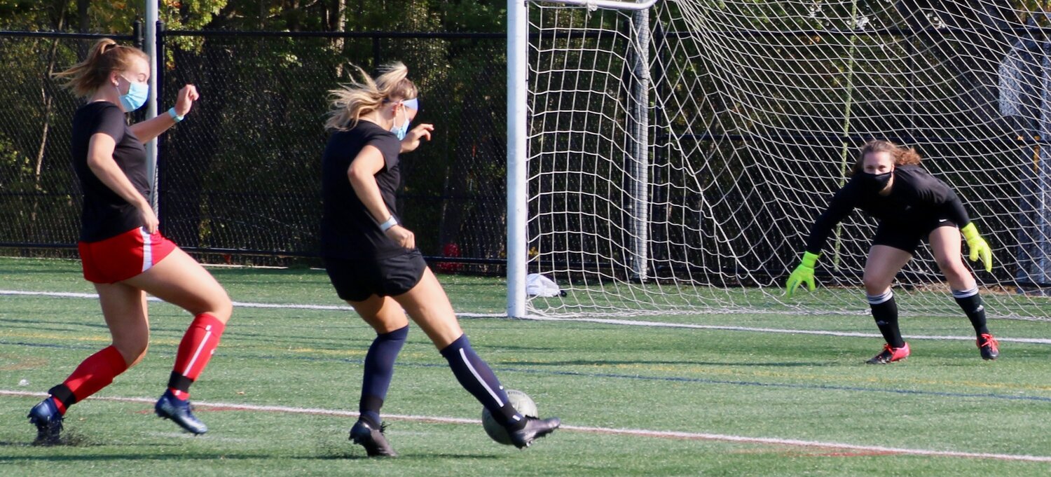 Coach Cosgrove ran a series of comprehensive soccer drills for the varsity and junior varsity girls’ soccer team. Here an exercise in passing and shooting on goal as the keeper defends. The Lady Hornets open at home on Saturday the 3rd at 3:00 versus CAL opponent, Ipswich.