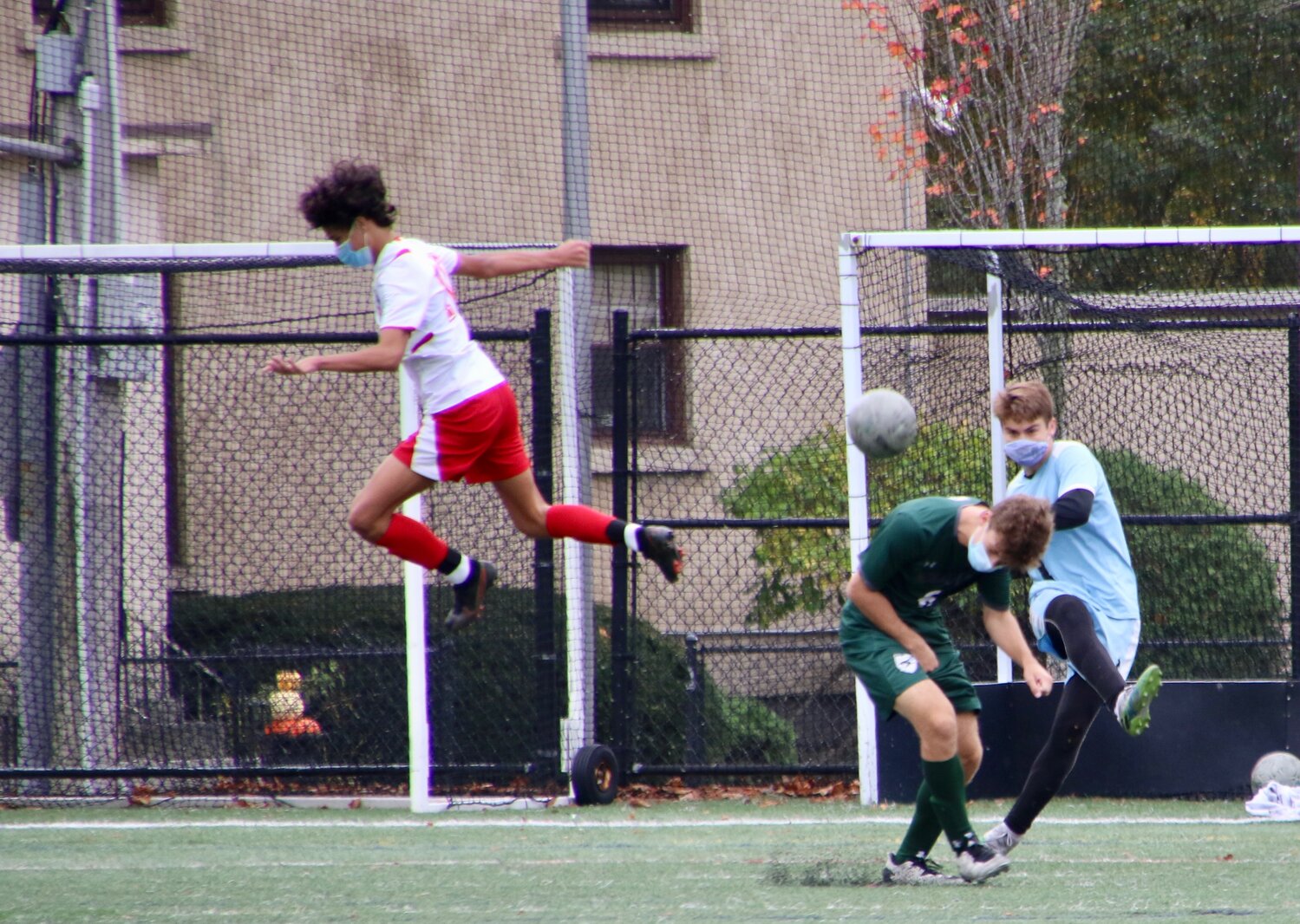 As keeper, Finn Carlson, kicks the ball down the field a Hornet player ducks as an Amesbury opponent flies through the air. The Hornets played the Indians to a 0-0 tie after 80 minutes of grueling play at Hyland Field on Saturday. Both teams were very active back and forth on the field demonstrating how fit the referees had to be to keep up the pace. More photos at https://www.facebook.com/TheManchesterCricket/. 