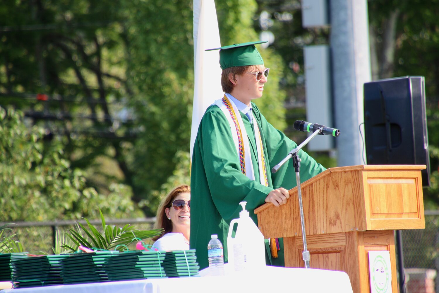 President of the MERHS Class 0f 2020, Thymen de Widt, addresses his classmates at a socially- distanced graduation ceremony on Friday afternoon. A beautiful afternoon greeted relatives of the class, during a less-than-normal gathering at Hyland Field. 