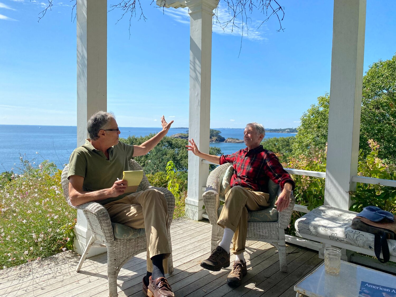 Matt Genta and Charles Hopkinson speak on the terrace of the Hopkinson House on Sharksmouth Estate.