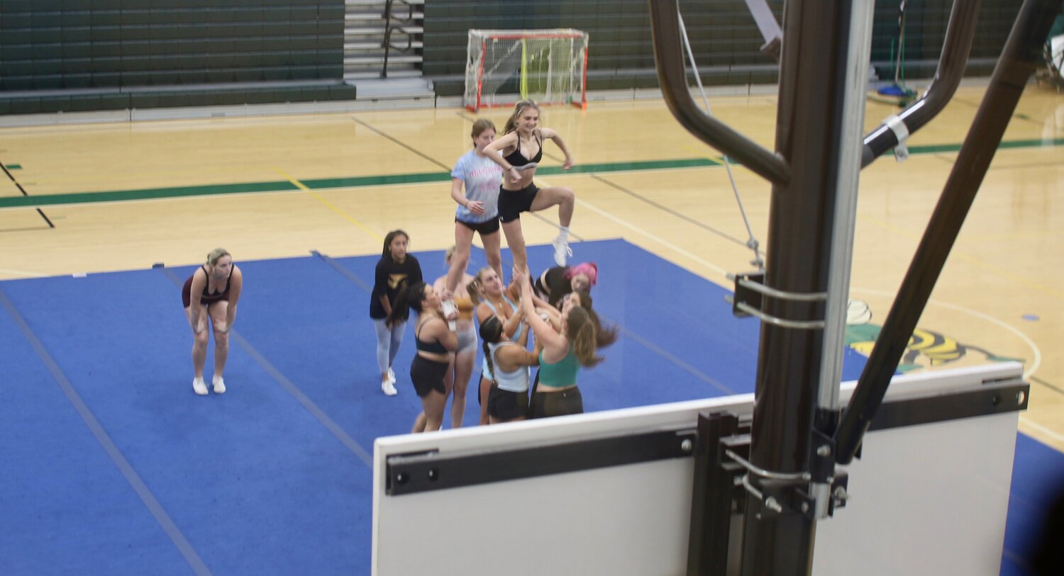 The ME Cheer Squad Competition Team practices for the upcoming CAL Meet.