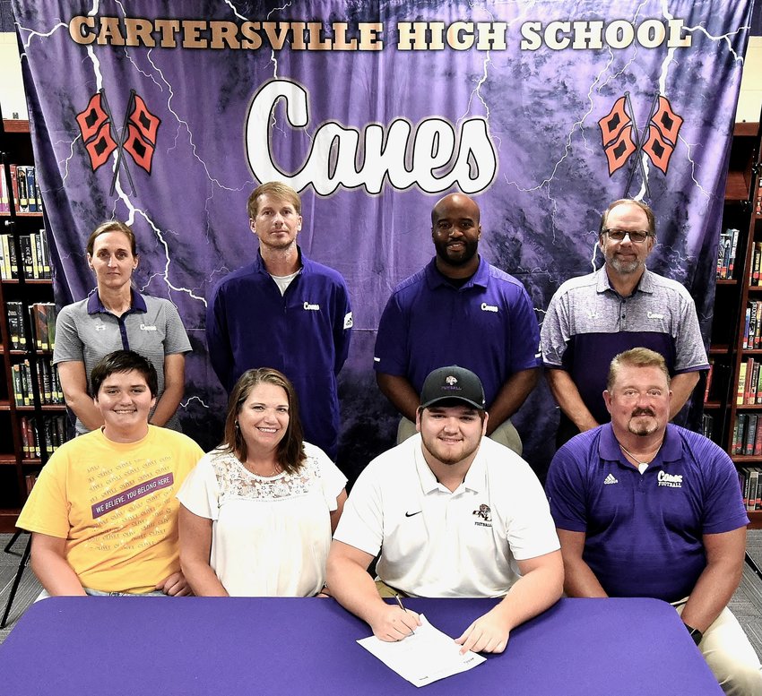 Cartersville High 2020 graduate Matthew Surrett signed to play football at Olivet Nazarene in Bourbonnais, Illinois. On hand for the signing were, from left, from left: Luke Surrett, brother; Mindy Surrett, mother; and Randy Surrett, father; back row: Shelley Tierce, CHS principal; Conor Foster, CHS head football coach; Reggie Perkins, CHS assistant football coach; and Darrell Demastus, CHS athletic director.