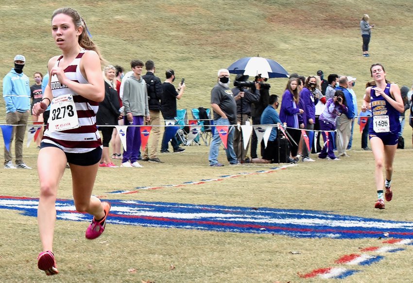 Woodland junior Rylee Evans heads towards the finish line to complete the Class 5A state cross country meet in fourth place Saturday in Carrollton.