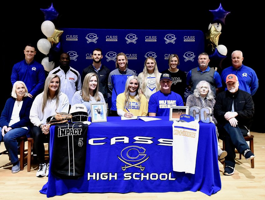 Cass High senior Rachael Lee signed Friday to play softball at Gulf Coast State College in Panama City, Florida. On hand for the signing were, from left, front row: Cheryl Patterson, grandmother; Hannah Lee, sister; Kim Lee, mother; Randy Lee, father; Susan Lee, grandmother; Bo Lee, uncle; back row, Steve Revard, CHS principal; Kevin Gainer, travel ball coach; Tyler Washington, CHS assistant softball coach; Taylor Washington, CHS head softball coach; Sierrah Woods and Casey Page, CHS assistant softball coaches; Patrick McElhaney, travel ball coach; and Nicky Moore, CHS athletic director.