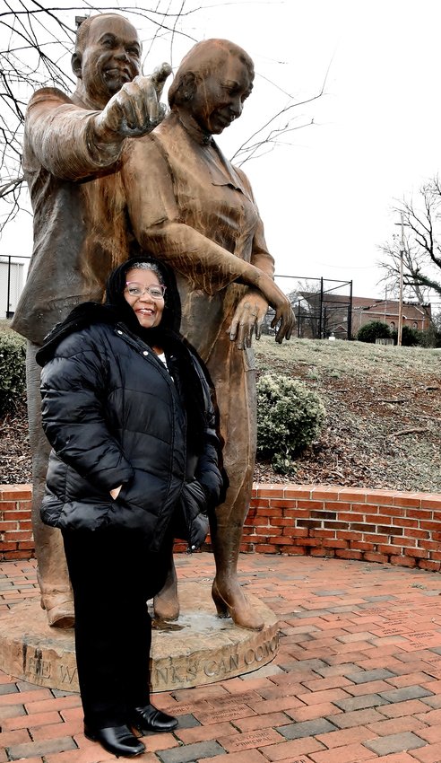 Diane Morgan is the winner of this year&rsquo;s local Dr. Martin Luther King Jr. Drum Major Award. She is standing in front of a statue on the Summer Hill Complex that pays tribute to her husband&rsquo;s paternal grandparents &mdash; J.S. Morgan Sr. and Beatrice Morgan&mdash; who were educators at the former African-American school.