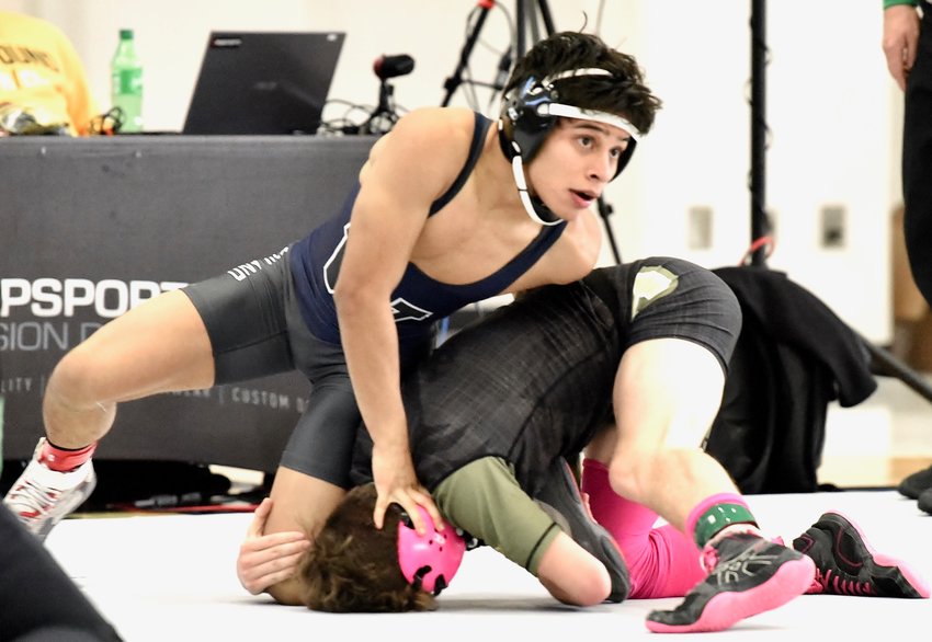 Woodland junior Marvin Hernandez grapples with an Ola opponent during the Class 5A state duals championship third-place match Jan. 22 at McDonough.