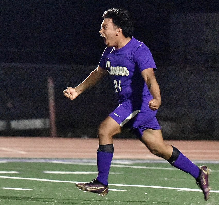 Cartersville senior Brian Juarez reacts to his successful penalty kick that secured a 4-2 win in a shootout against Cross Keys after the teams finished 100 minutes tied at 2-2 in a Class 5A state tournament first-round matchup April 13 at Weinman Stadium. With the victory, the Canes advance to the Sweet 16, where they will face Region 1-5A champion Veterans.