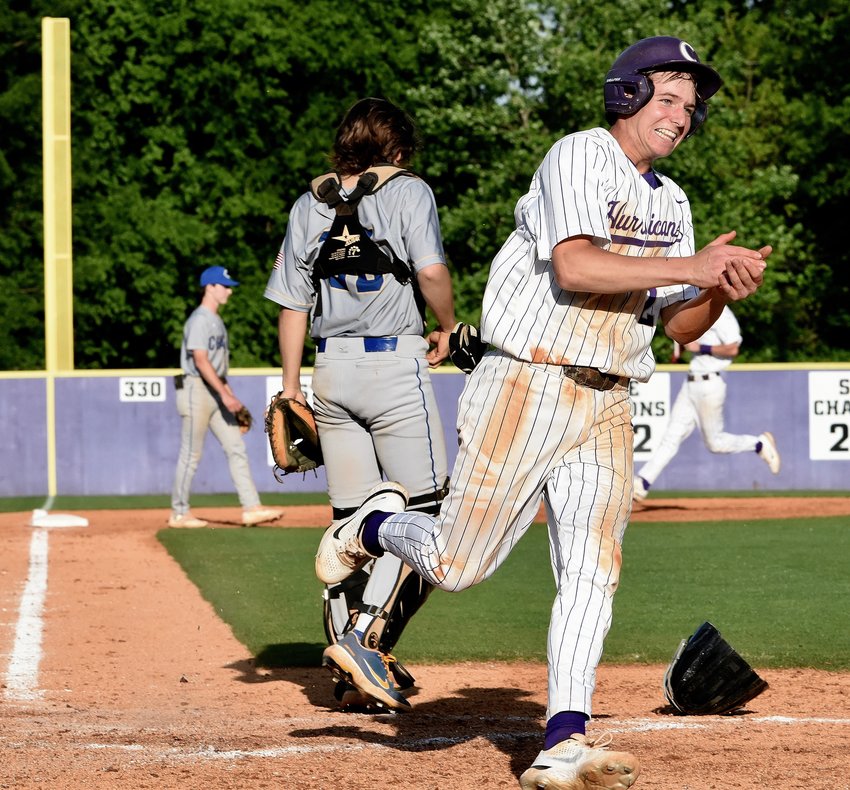 Cartersville sophomore Caleb Daniel scores the winning run in the bottom of the eighth inning during Game 1 of a Class 5A state tournament first-round series against Chamblee April 27 at Richard Bell Field. The Canes won both games of a doubleheader to sweep the best-of-three series and reach the second round.