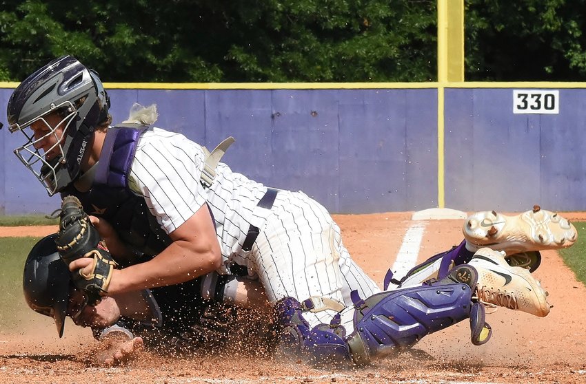 Cartersville senior Hank Smith tags an Apalachee runner out at the plate during Game 1 of a Class 5A state semifinal series May 14 at Richard Bell Field. The Canes swept the series to reach the state championship round, where they will face Loganville in a best-of-three set starting May 21 at AdventHealth Stadium in Rome.