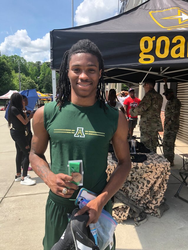 Adairsville senior Tre Mitchell holds his medal after placing fourth in the 400-meter dash during the Class 3A state meet May 14 at Carrollton High.