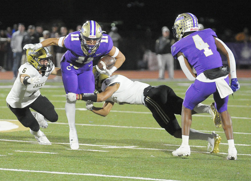 Cartersville's Collin Fletcher runs after the catch as Romo Pace looks on. The Hurricanes will host Clarke Central at 6:30 p.m. on Saturday in the first round of the playoffs.