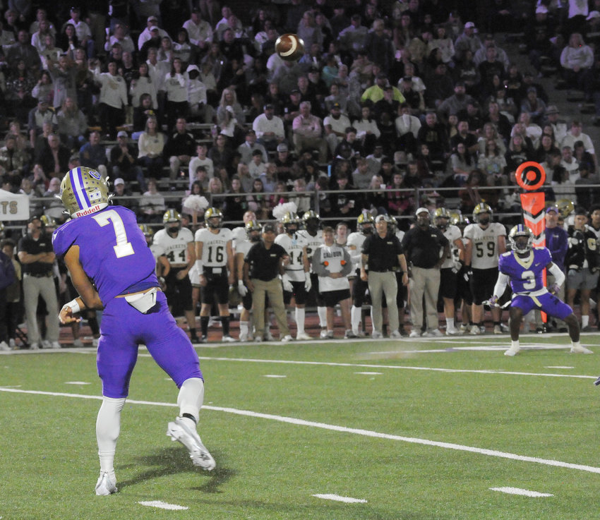 Cartersville quarterback Paul Gamble throws a pass to receiver Ja'mauri Brice during last week's game against Calhoun. The Hurricanes will travel to Region 7-5A rival Cass this Friday.