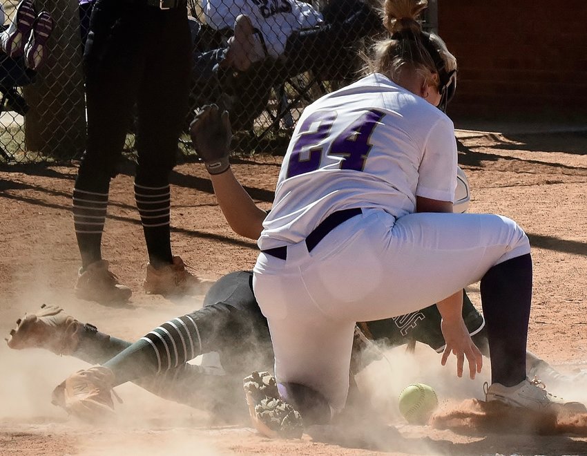 Cartersville pitcher Kennedy Stevens tries to tag a Eastside runner out at the plate during Thursday's first game.