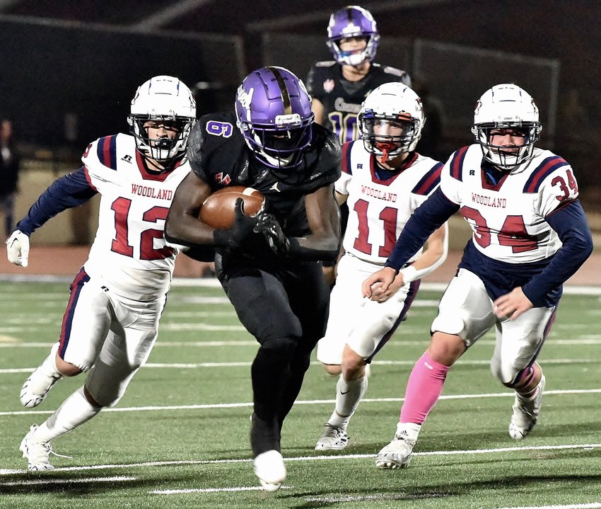 Khristian Lando had three touchdowns for the Purple Hurricanes in Cartersville's 31-6 win over Woodland on Oct. 21.
