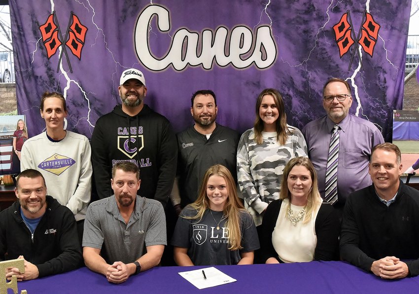 Cartersville High senior Ava Perkins signed to play softball at Lee University in Cleveland, Tennessee. On hand for the signing were, front row, from left: Clifton Bennett, strength coach; Dave Perkins, father; Allison Perkins, mother; and Ken Dishman, travel ball coach. Back row: Shelley Tierce, CHS principal; Kyle Arnold, CHS assistant softball coach; Glenn Woodard, CHS head softball coach; Hannah O'Sheilds, CHS assistant softball coach; and Darrell Demastus, CHS athletic director.