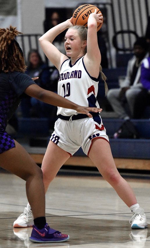 Woodland's Reagan Weightman looks to make a pass during Tuesday's home game against Hiram. Woodland lost 68-16 to one of the top class 5A teams in the state.